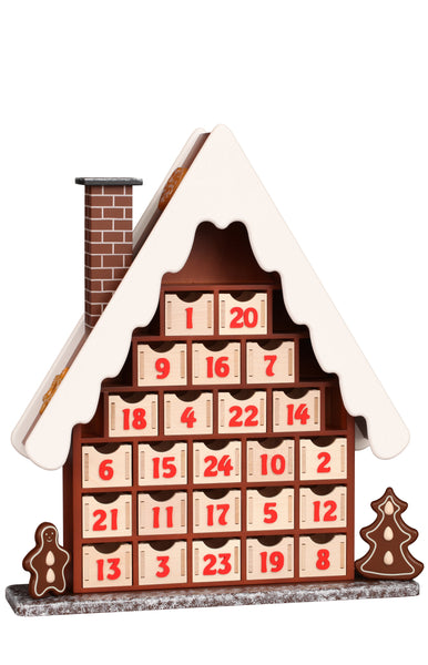 Wooden advent calendar shaped like a house with gingerbread men on a white background